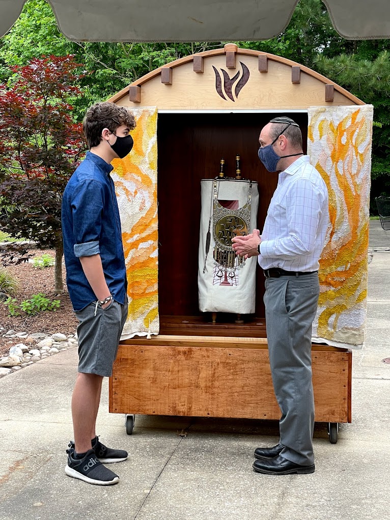 Rabbi and Noah Raney in front of Torah Scroll